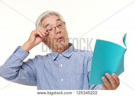 portrait of senior Japanese man with presbyopia