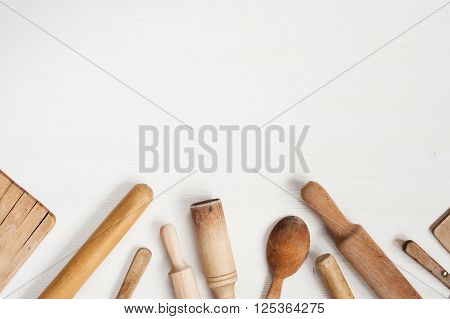 Kitchen utensils on the white wooden table