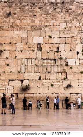 JERUSALEM, ISRAEL - MARCH 25th: People praying in the Western Wall, in Jerusalem. The holy place for jews people March 25, 2016, Jerusalem, Israel.
