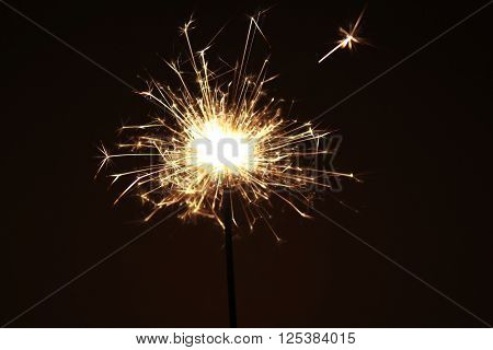 A detailed shot of a firework sparkler, bengal light.