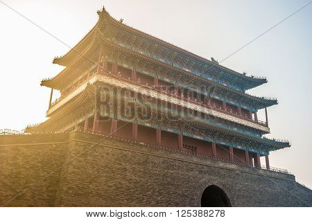Beijing, China at the Zhengyangmen Gatehouse in Tiananmen Square. Beautiful historical building at sunset.