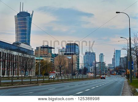 Warsaw, Poland - March 28, 2016: Kasprzaka street, Office building Warsaw Spire under construction in Warsaw, Poland. Warsaw Spire is a modern landmark and a powerful symbol of Warsaws energy.