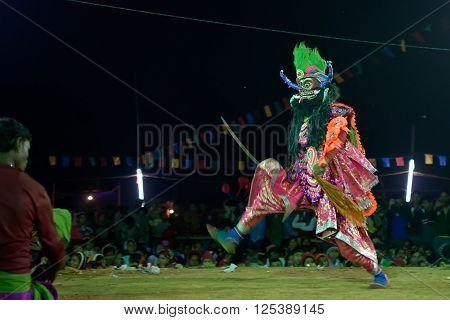 BAMNIA PURULIA WEST BENGAL INDIA - DECEMBER 23RD 2015 : Dancer performing at Chhau Dance festival resurrecting a demon. It is a Indian tribal martial dance based on Hindu myth.