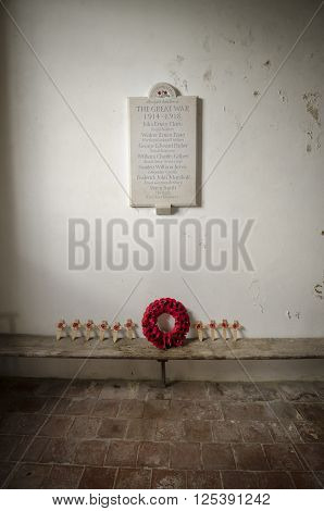 ST GEORGE'S CHURCH IVYCHURCH KENT UK 25 FEBRUARY 2016 - War memorial for the great war of 1914 - 1918 and poppy tributes