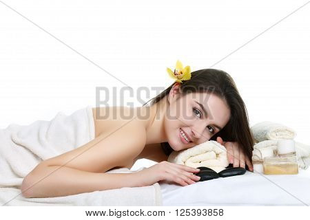 Young spa woman touching her face after beauty treatment