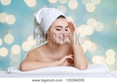 spa woman touching her face after beauty treatment