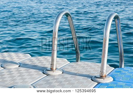 Boarding Ladder For Swimmers Mounted On A Plastic Floating Dock