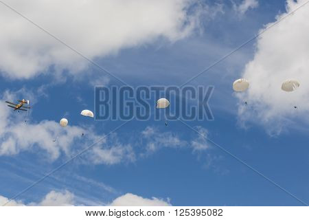 Minsk Belarus-June 21 2014: Parachute Jumpers Performing Air Elements on AN-2 Airplane During Aviation Sport Event Dedicated to the 80th Anniversary of DOSAAF Foundation in Minsk on June 21 2014 in Minsk Republic of Belarus
