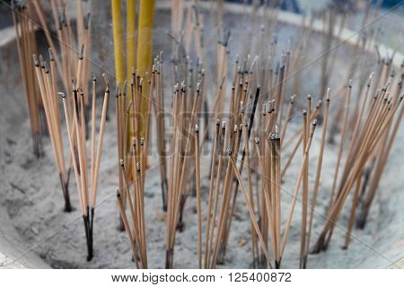 Joss Sticks Smolder On A Buddhist Altar In A Temple
