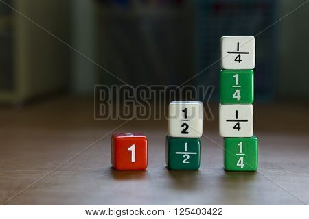 Fraction dices stack up on desk selective focus on dices blurred background