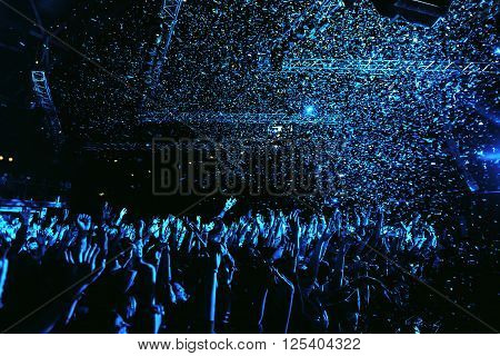 night party concert crowd of people silhouettes hands up