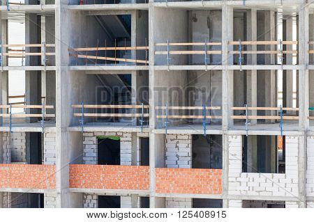 Monolithic frame construction of the building. Solid walls of concrete. Formwork for walls made of concrete. Construction of the building. Masonry walls and aerated concrete masonry walls
