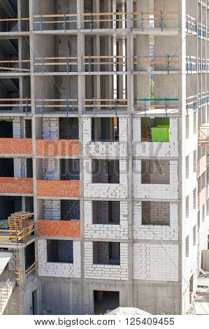 Monolithic frame construction of the building. Solid walls of concrete. Formwork for walls made of concrete. Construction of the building. Masonry walls and aerated concrete masonry walls