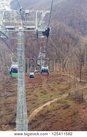ROSA KHUTOR, RUSSIA - MARCH 27, 2016: Top view of Rosa Khutor cableway at the end of March