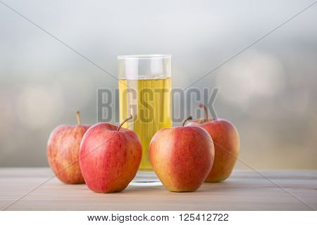 variety of fruits and orange juice on a wooden table, studio picture