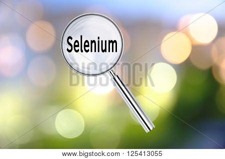 Magnifying lens over background with text Selenium, with the blurred lights visible in the background. 3D rendering