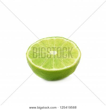 Ripe green lime cut in half isolated over the white background