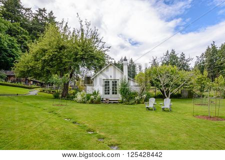 Beautiful country cottage with a large green garden.