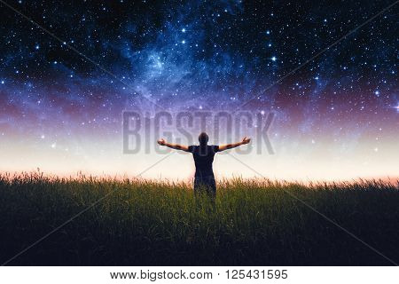 Silhouette of man and stars sky. Elements of this image furnished by NASA