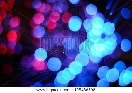Blurred abstract pink and blue bokeh lights. Christmas holiday defocused background. Backdrop for your design