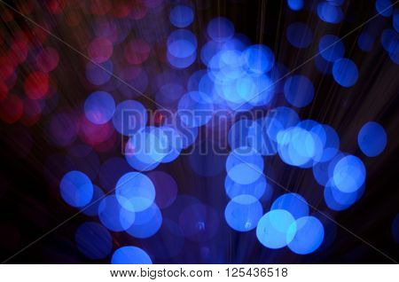 Blurred abstract pink and blue bokeh lights. Christmas holiday defocused background. Backdrop for your design