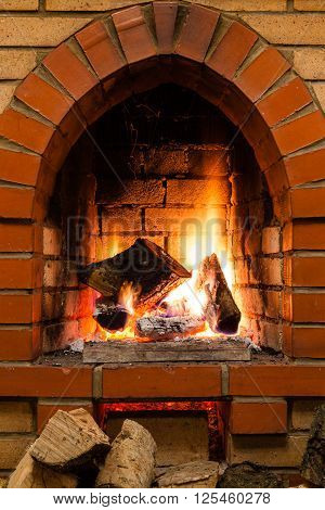 Few Wood And Burnuing Logs Fire In Fireplace