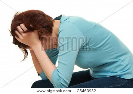 studio shot of depressed woman on white background