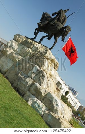 Skanderbeg's monument Tirana Albania and Albanian national flag flying