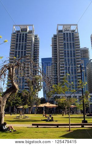 TEL AVIV, ISRAEL - APRIL 7 2016: People in park on Sarona Market area near Gindi buildings in Tel Aviv, Israel. Recently open Sarona Market became the most popular place in Tel Aviv.