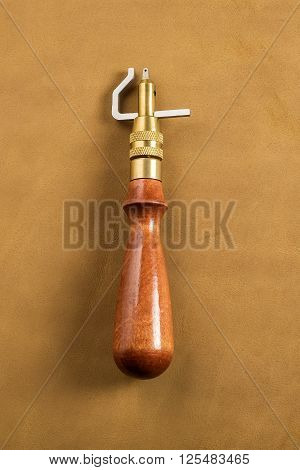 Stitching Groover with wooden handle on leather
