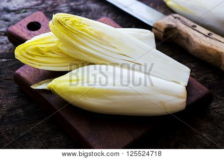 Fresh Chicory Salad  On  Rustic Wooden Table.