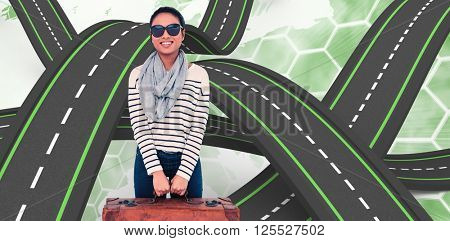 Asian woman with luggage looking at the camera against background with europa map