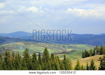 Landscape of the valley with mountains in the distance, summer