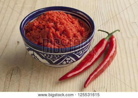 Bowl with Moroccan red harissa and fresh red peppers