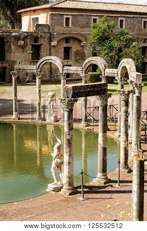Ancient ruins of Villa Adriana(Canopus canal pool surrounded by columns and statues) Tivoli Italy