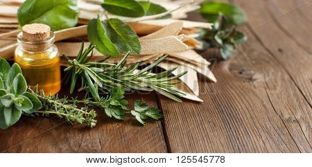 Whole wheat artisan pasta olive oil and herbs on old wooden table