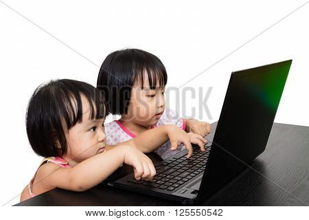 Asian Little Chinese Girls Playing Laptop Computer in Isolated White Background