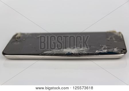 Berlin Germany - april 12 2016: Photo of a iPod touch with broken display. Isolated on white background.