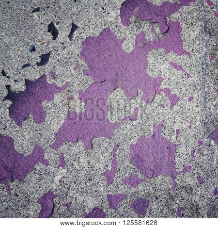 Colorful old paint on concreat surface. Grunge background. Frame for text. Copy space. Street graffiti closeup. Aged photo. Vintage photo. Color wall macro background. City building decay texture.