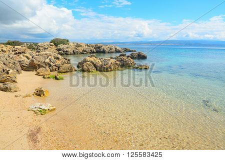rocks and sand in Alghero coastline Sardinia