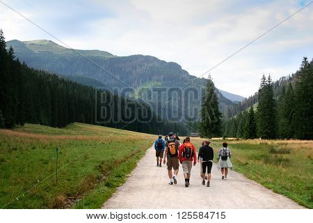 Zakopane Poland - August 15 2011: Tourists go on the hiking trail on the Koscieliska Valley in Tatra Mountains.