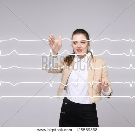 Doctor woman working with cardiogram lines
