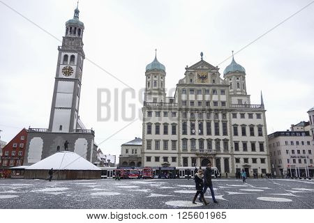 Augsburg Germany - January 16 2016: Rathausplatz and tourists in city of Augsburg during winter time Swabia Bavaria Germany. Augsburg is Germany's third oldest city.