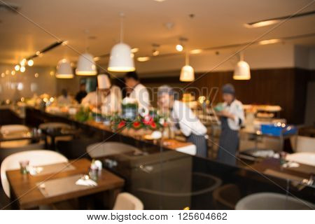 Abstrast Blurred background : restaurant cafe blur with chef