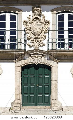 Facade of the Manor of the Vasconcelos with the coat of arms on top of the door in Vila do Conde Portugal