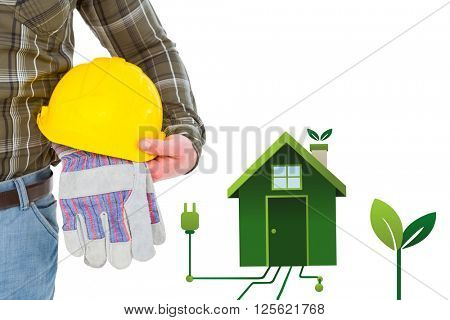 Manual worker holding helmet and gloves against clean energy house