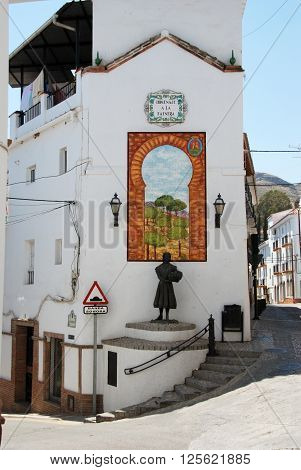 ALORA, SPAIN - JUNE 27, 2008 - Homage to the worker (Homenaje a la Faenera) statue and picture on a street corner Alora Malaga Province Andalusia Spain Western Europe, June 27, 2008.