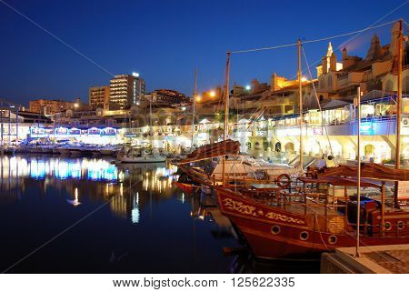 BENALMADENA, SPAIN - JUNE 29, 2008 - View of yachts and restaurants in the harbour at dusk Benalmadena Malaga Province Andalusia Spain Western Europe, June 29, 2008.