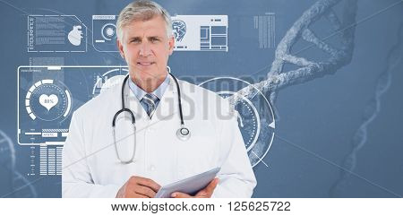 Doctor looking at camera and holding tablet against image of a dna