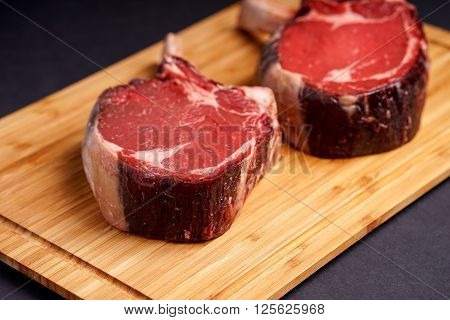 Raw Dry aged tender delicious Tomahawk Steak